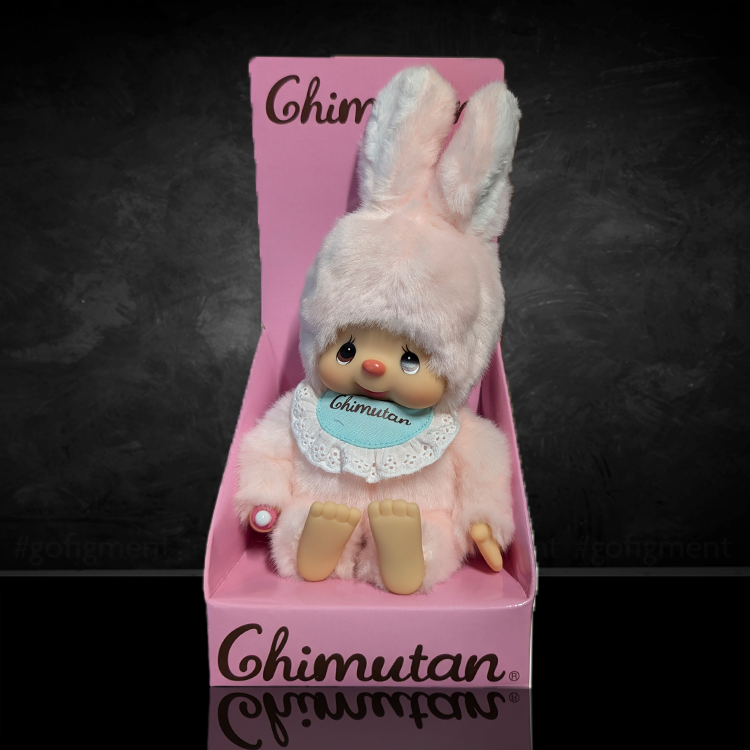 Sekiguchi Monchhichi Chimutan pink bunny plush with baby blue bib sitting in branded pink box