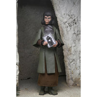 Zira Planet of the Apes Legacy Series 7-Inch Scale Action Figure by Neca posed holding a photo inside a cave setting