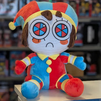Front view of Glitch Pomni plush toy in vibrant red, blue, and yellow jester costume from The Amazing Digital Circus collection