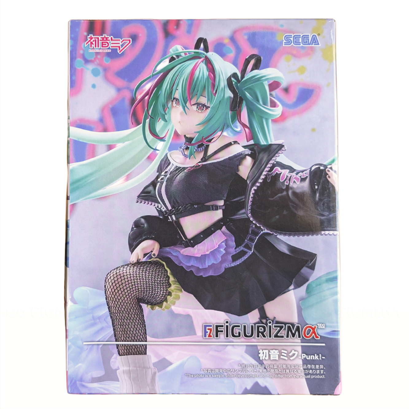 Anime-style figure of a girl with teal hair in twin tails wearing a punk-inspired black outfit with fishnet stockings