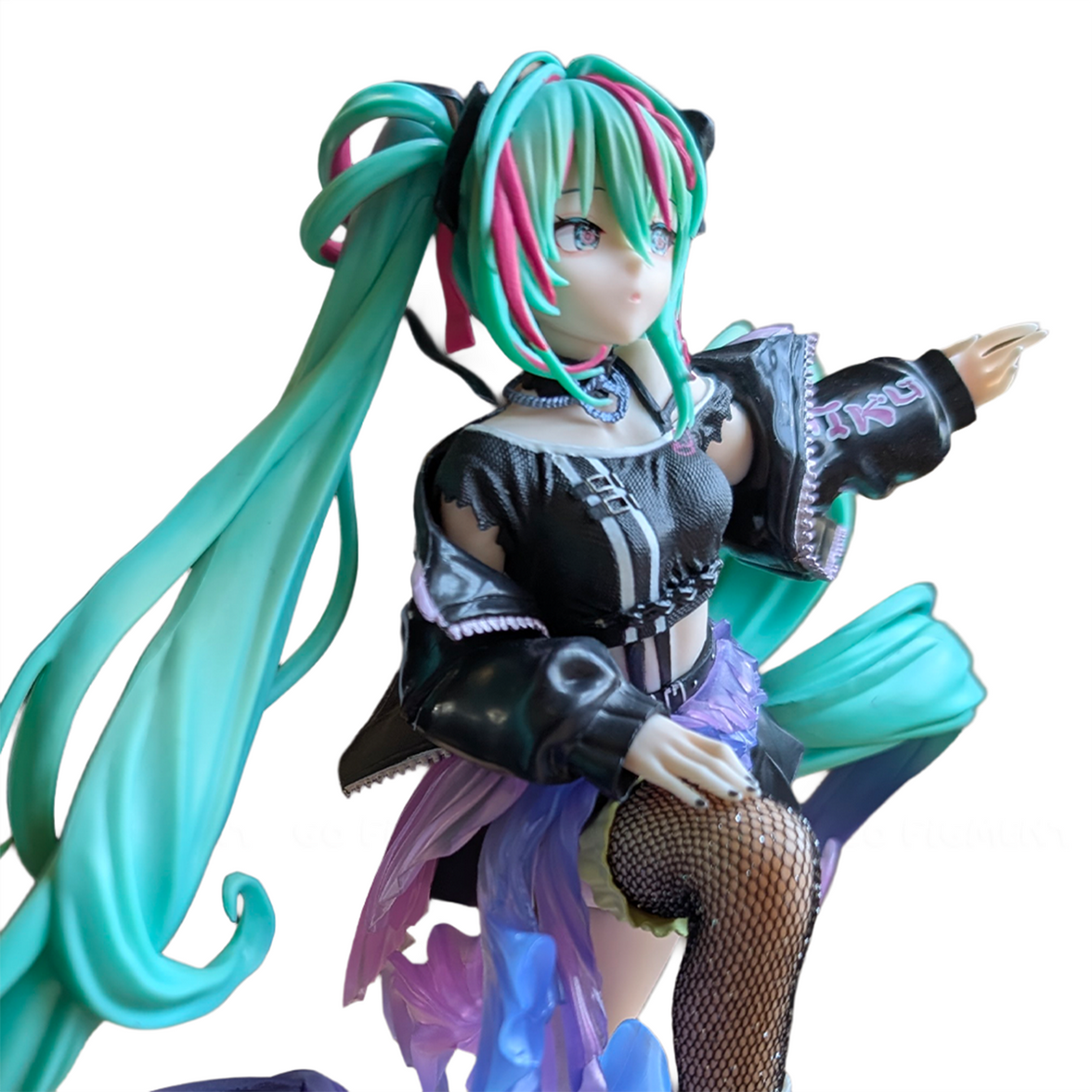 Anime-style collectible figure with vibrant teal hair, black outfit, and detailed fishnet stocking pose