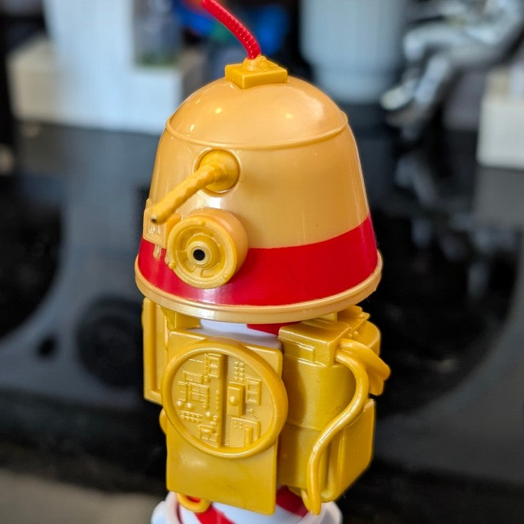 Loose Kenner R1 Christmas Bell Droid action figure with red stripe and yellow body, 3.75-inch Star Wars collectible