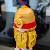 Loose Kenner R1 Christmas Bell Droid action figure with red stripe and yellow body, 3.75-inch Star Wars collectible