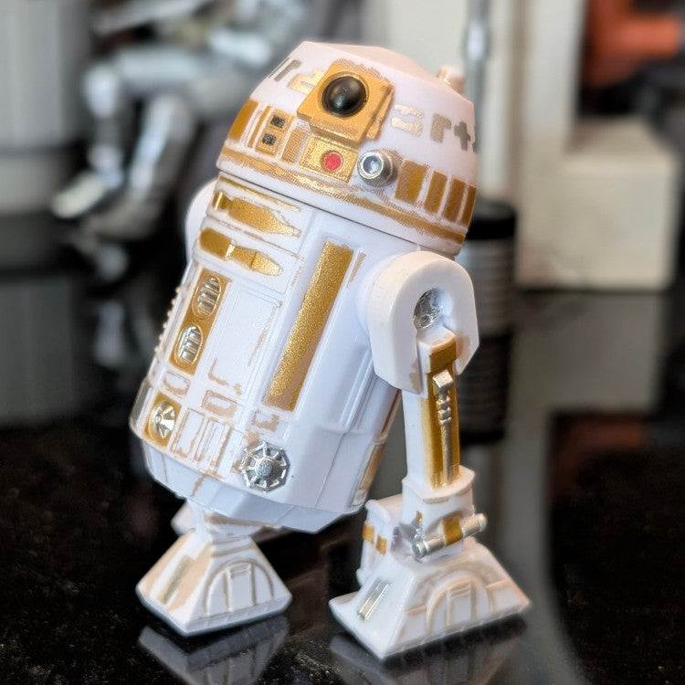 Kenner R6-D3 Star Wars Droid Factory loose 3.75-inch action figure with white and gold details on black surface.