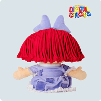 Glitch Ragatha plush showing back view with red yarn hair, purple patchwork dress, and light purple bow on pale background