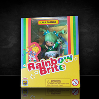 Lala Orange Rainbow Brite collectible figure in colorful yellow packaging with rainbow stripes and logo.