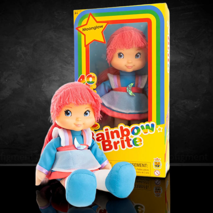 Moonglow Rainbow Brite 12-inch plush doll with pink hair and blue outfit in colorful window-style packaging by The Loyal Subjects