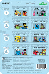 Packaging back featuring Sesame Street character portraits arranged in rows, with waves and logos on a light blue brick background.