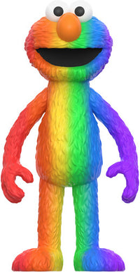 Colorful furry character figure with a rainbow gradient, large eyes, orange nose, and open mouth smiling upright