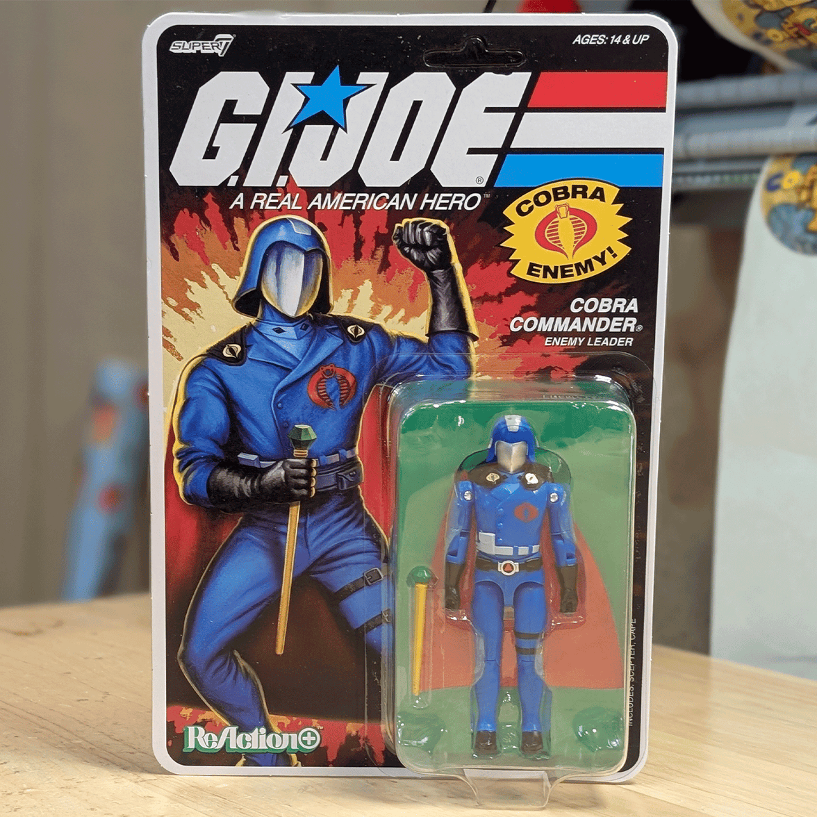 Super7 G.I. Joe Cobra Commander action figure in blue uniform with staff in retro ReAction+ packaging