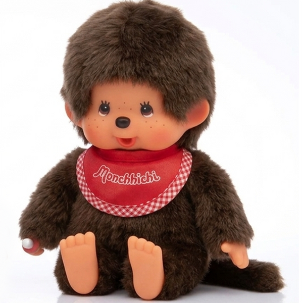 8" Large Monchhichi Doll - Classic Boy, Red Bib - Authentic Monkey Plush, NWT by Sekiguchi seated with fuzzy brown fur and red bib