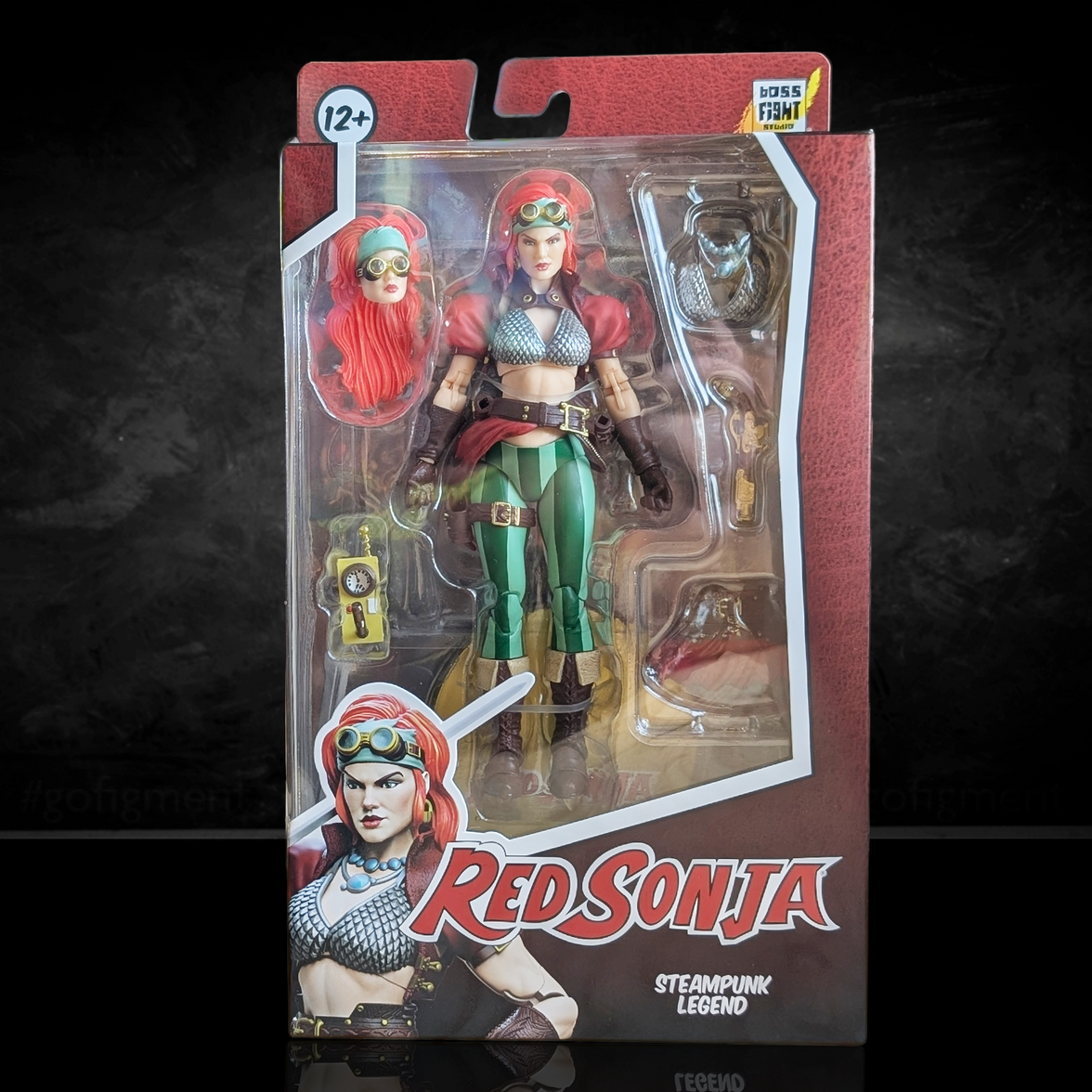 Red Sonja action figure in packaging with 'Red Sonja' branding on a dark background