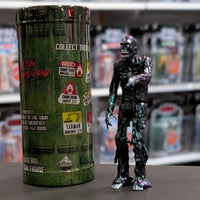 Super7 metallic blue graffiti style tar-covered zombie figure standing next to green collectible container on store shelf
