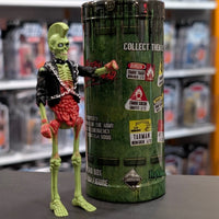 Super7 neon green male zombie figure with mohawk, skeletal torso, exposed red intestines, and black jacket with chains standing beside collectible tube