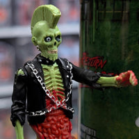 Super7 neon green male zombie figure with mohawk wearing black jacket and chains reaching forward near green collectible tube