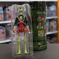 Super7 neon green male zombie figure with mohawk, exposed red intestines, skeletal legs, black jacket with chains in packaging