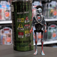Super7 metallic blue graffiti male zombie figure with skeletal details, mohawk, chains, and black jacket standing next to collectible tube