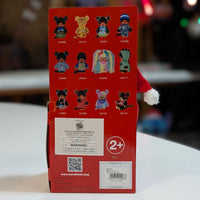 Sekiguchi Monchhichi collectible plush dolls lineup displayed on red packaging back with product codes and safety details