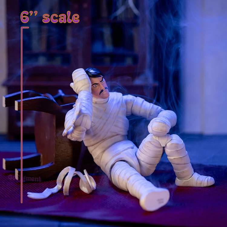 Jada Toys Scooby-Doo Mummy of Ankha 6-inch action figure seated with unmasked head sculpt and extra bandages on floor.