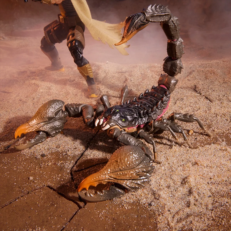 Hasbro G.I. Joe Cobra Desert Scorpion mechanical pet figure in desert setting with action figure legs visible