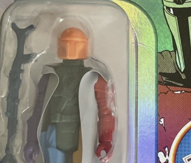 Go Figment Star Wars Retro Collection Prototype Edition action figure in packaging with orange helmet and red arm details