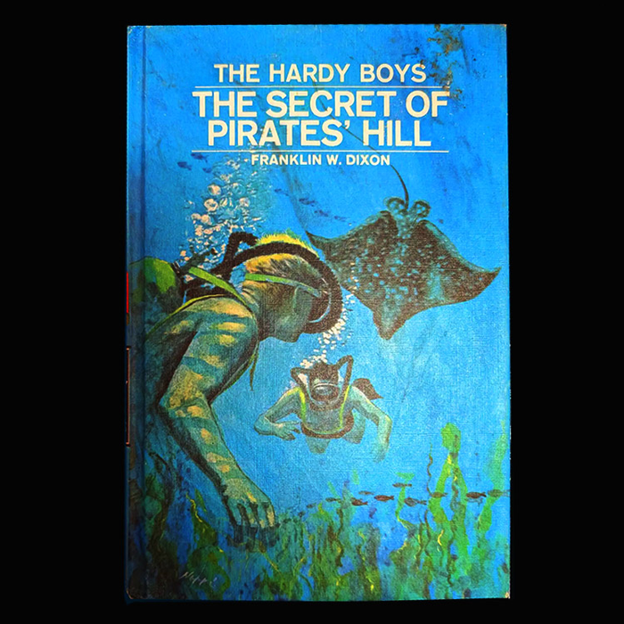 Vintage Hardy Boys book The Secret of Pirates' Hill by Franklin W. Dixon with underwater adventure cover art