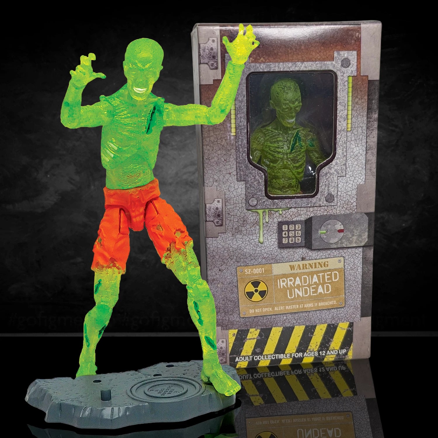 Green radioactive zombie figure with orange pants next to its packaging on a dark background