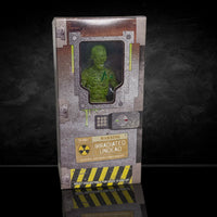 Green figure in a box with radioactive design on a dark background