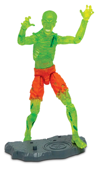 Toy figure of a green zombie with orange shorts on a white background