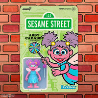 Super7 Sesame Street Abby Cadabby 3.75-inch ReAction Figure collectible in mint packaging on brick background