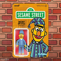 Bert action figure wearing blue and purple striped pajamas with matching nightcap in colorful Sesame Street card backing