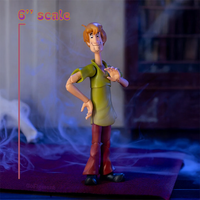 Detailed 6-inch Shaggy Rogers action figure from Scooby-Doo by Jada Toys, posed with hand raised.