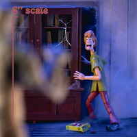 Shaggy Rogers action figure in 6-inch scale posed scared near broken cabinet from Jada Toys Scooby-Doo set