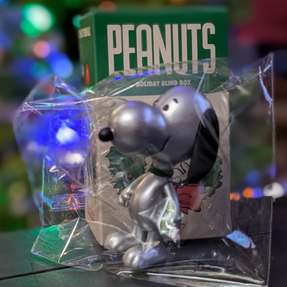 Silver Snoopy figure in metallic finish from Super7 Holiday Blind Box Wave 8 in clear protective packaging