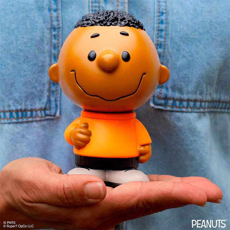 Funko Franklin Fun Fun Mascot vinyl figure from Peanuts held in hand wearing orange shirt and black shorts