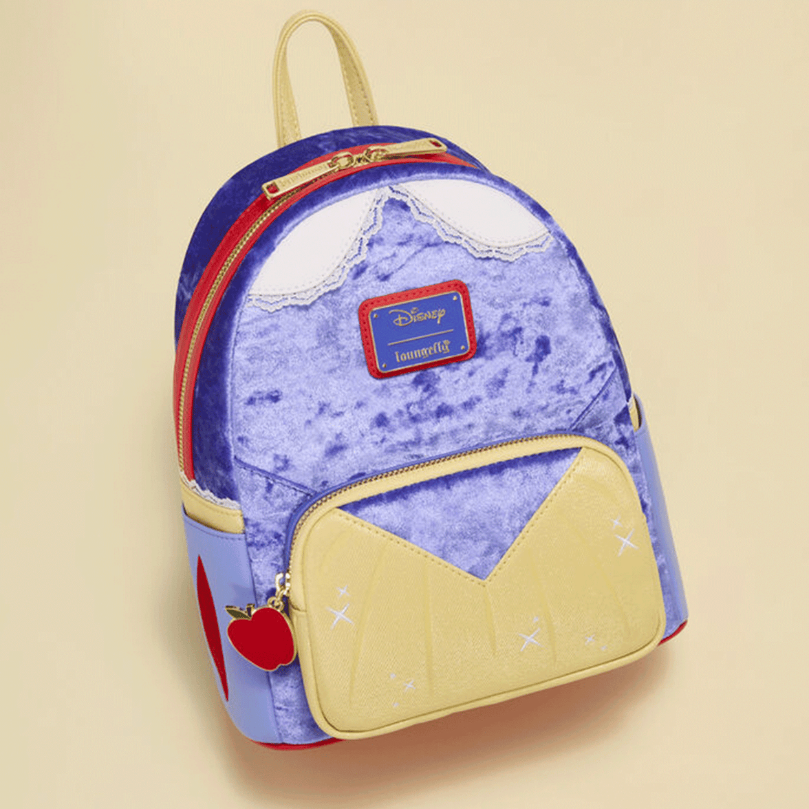 Loungefly mini backpack in plush blue and yellow with red apple charm and Disney Snow White inspired details