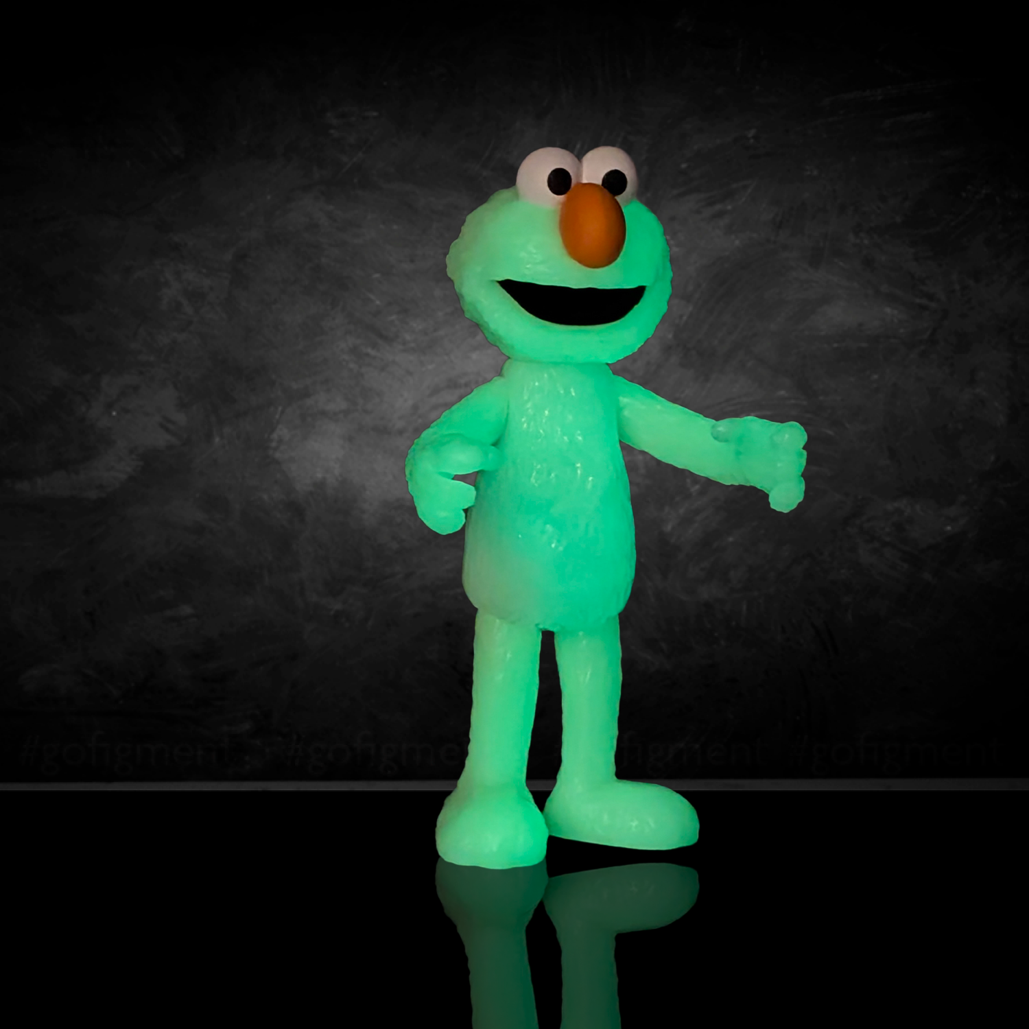 So Many Elmos! Sesame Street Blind Box Wave 4 figure by Go Figment glowing green with orange nose and wide eyes