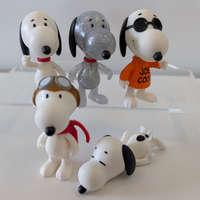 Super7 3.75-inch Peanuts figures featuring various Snoopy styles including aviator, glitter, classic, and Joe Cool designs