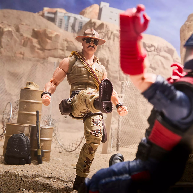 Hasbro GI Joe Classified Sgt Slaughter action figure in desert battle pose kicking Cobra enemy figure