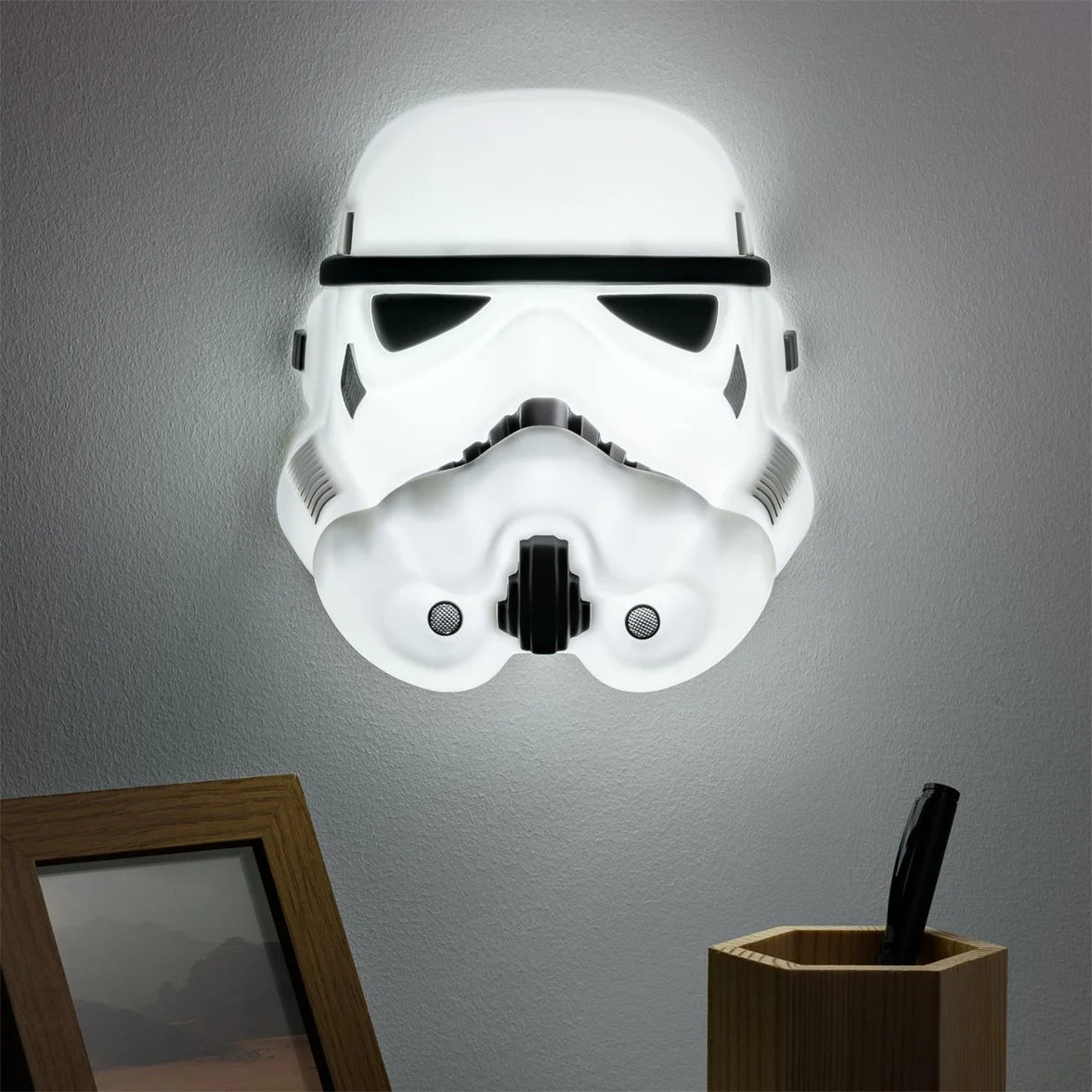 Star Wars Stormtrooper Mask Light - Wall Mountable LED Galactic Empire Lamp by Paladone glowing on wall in white and black design