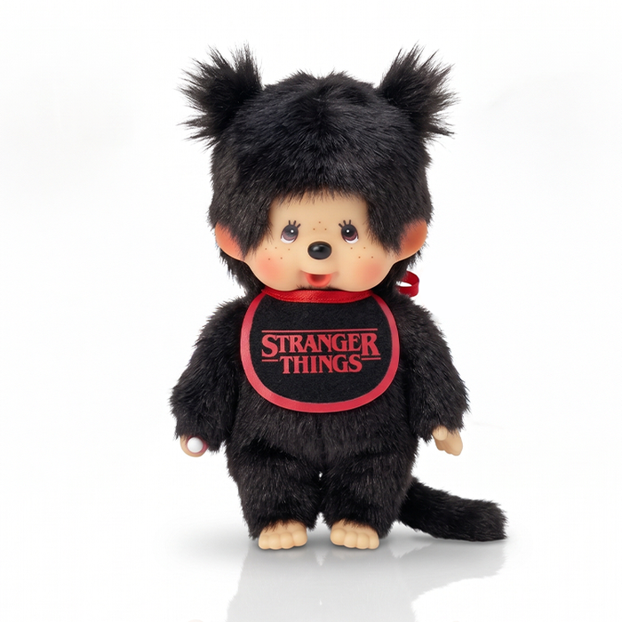 Black furry monkey doll with pigtails wearing a red Stranger Things bib on a white background