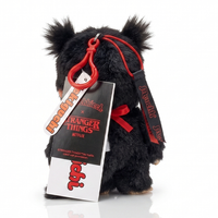 Black furry Monchhichi plush with red cord, carabiner, and Stranger Things tag.
