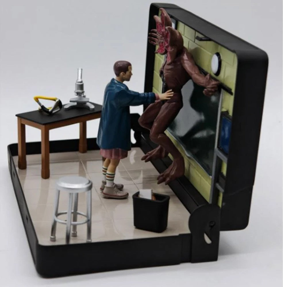 VHS Stars Stranger Things Eleven vs. Demogorgon Diorama Playset by Console Heroes featuring detailed character figures in a lab scene