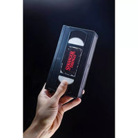 Hand holding a VHS tape labeled Stranger Things for the VHS Stars Stranger Things Eleven vs. Demogorgon Diorama Playset