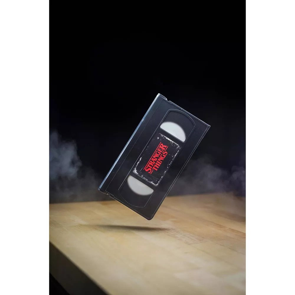 VHS Stars Stranger Things Eleven vs. Demogorgon Diorama Playset by Console Heroes with smoky background on wood surface