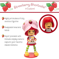 Boss Fight Studio Llc Strawberry Shortcake collectible figure with swappable parts, fruity scent, cake accessory, and display stand