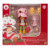 Boss Fight Studio Llc Strawberry Shortcake deluxe action figure with pink hat, green striped socks, custard kitten, and accessories in box