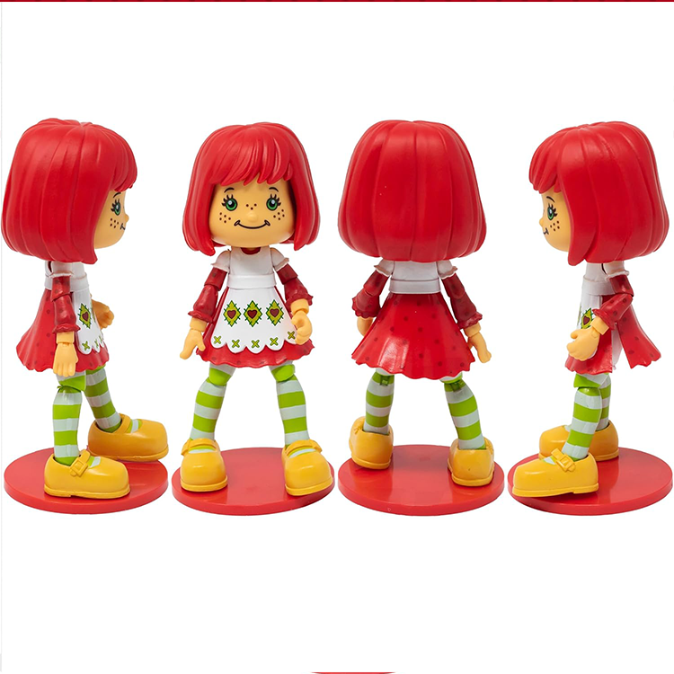 Boss Fight Studio Llc Strawberry Shortcake 1:12 scale articulated figure with red hair, green striped leggings, and yellow shoes on red stands