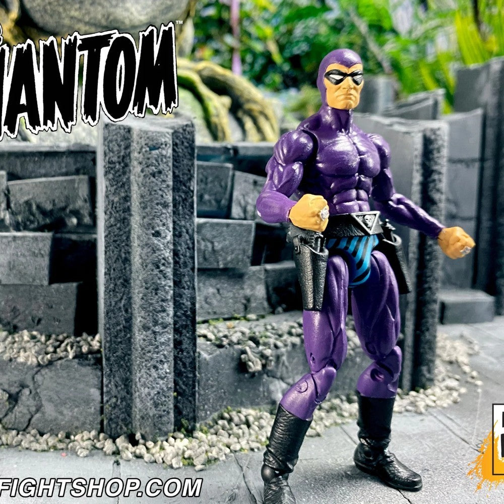 Action figure in purple costume with mask standing on a stone surface with 'FIGHTSHOP.COM' branding.