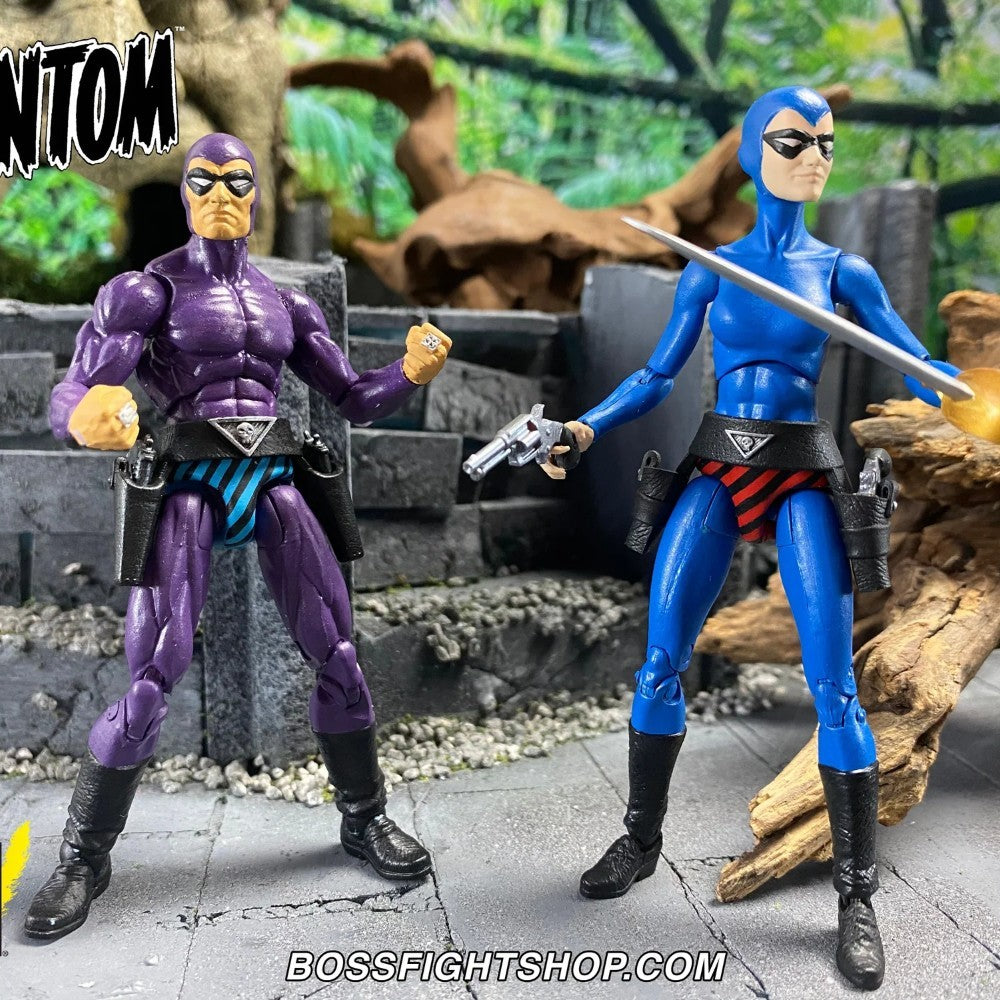 Two action figures, one purple and one blue, standing in a forest-like setting with 'BOSSFIGHTSHOP.COM' branding.